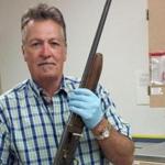 Seattle Detective Michael Ciesynski holds the shotgun that Kurt Cobain used to kill himself on April 8, 1994. 